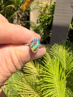 Handmade sterling silver ring featuring a natural Australian boulder opal with vivid electric blue, green, and turquoise flashes.