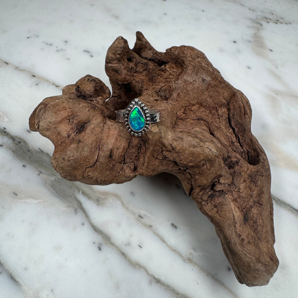 Ring with a green stone background