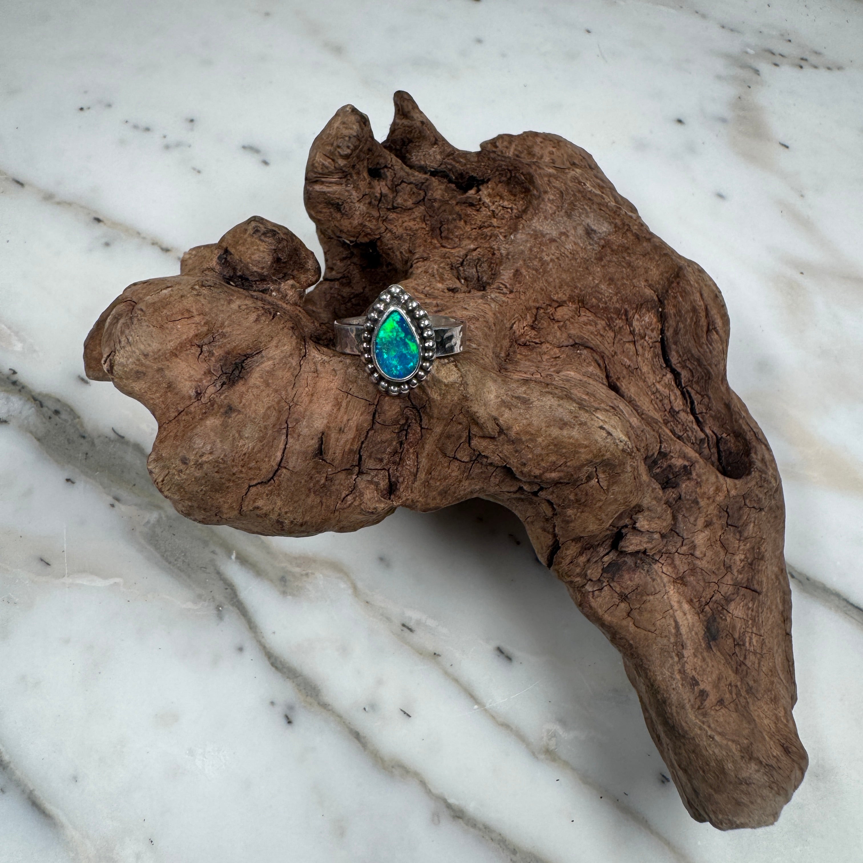 Ring with a green stone background