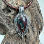 Luxury Australian Boulder Opal statement pendant featuring brilliant emerald green, teal, and golden fire in sterling silver.