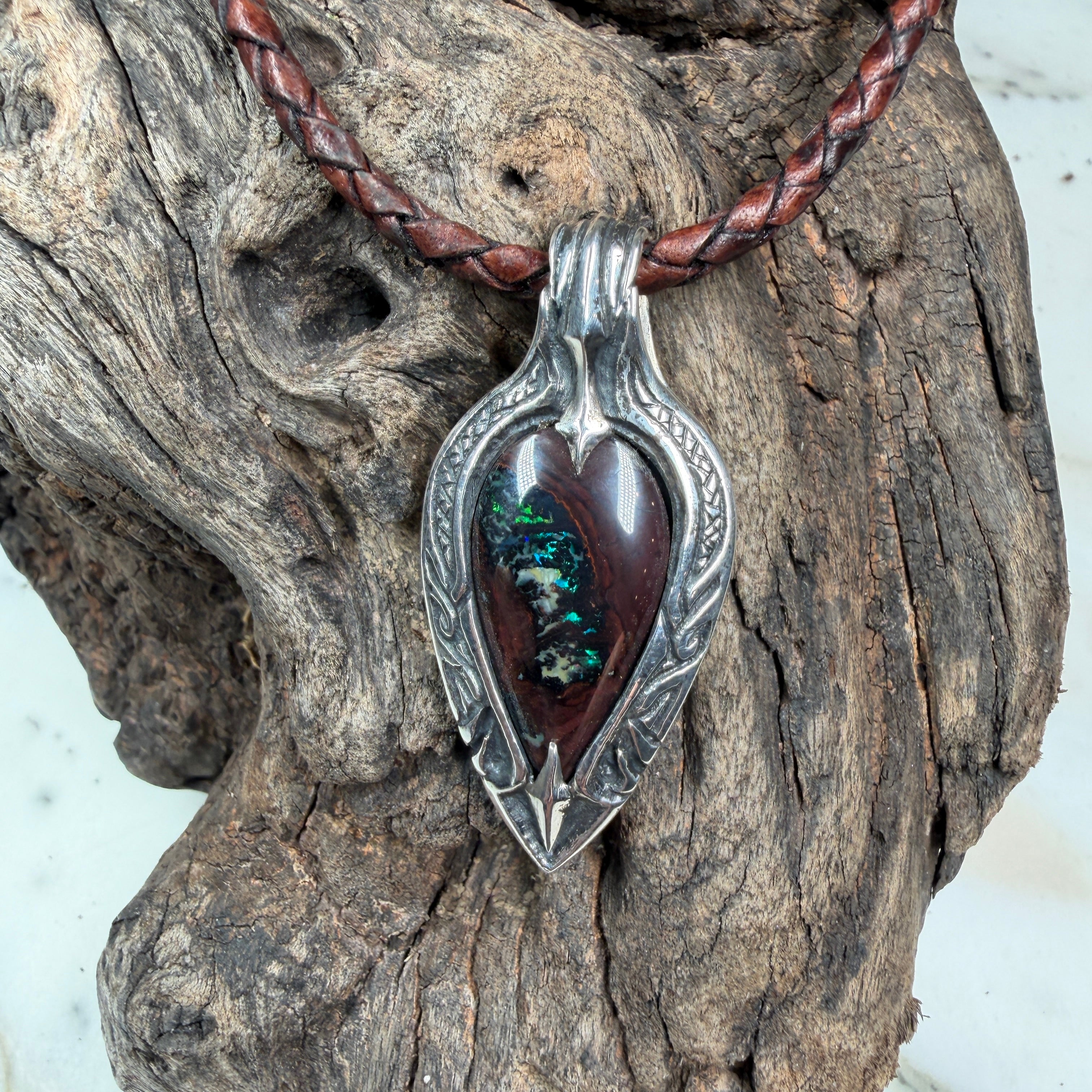 One-of-a-kind Emerald Haven pendant with natural Australian Boulder Opal, hand-engraved sterling silver, and sculpted integrated bail.