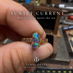 Sunset Current Australian boulder opal ring with multicolor flashes, a textured 14K yellow gold band, and a US size 6.5 fit