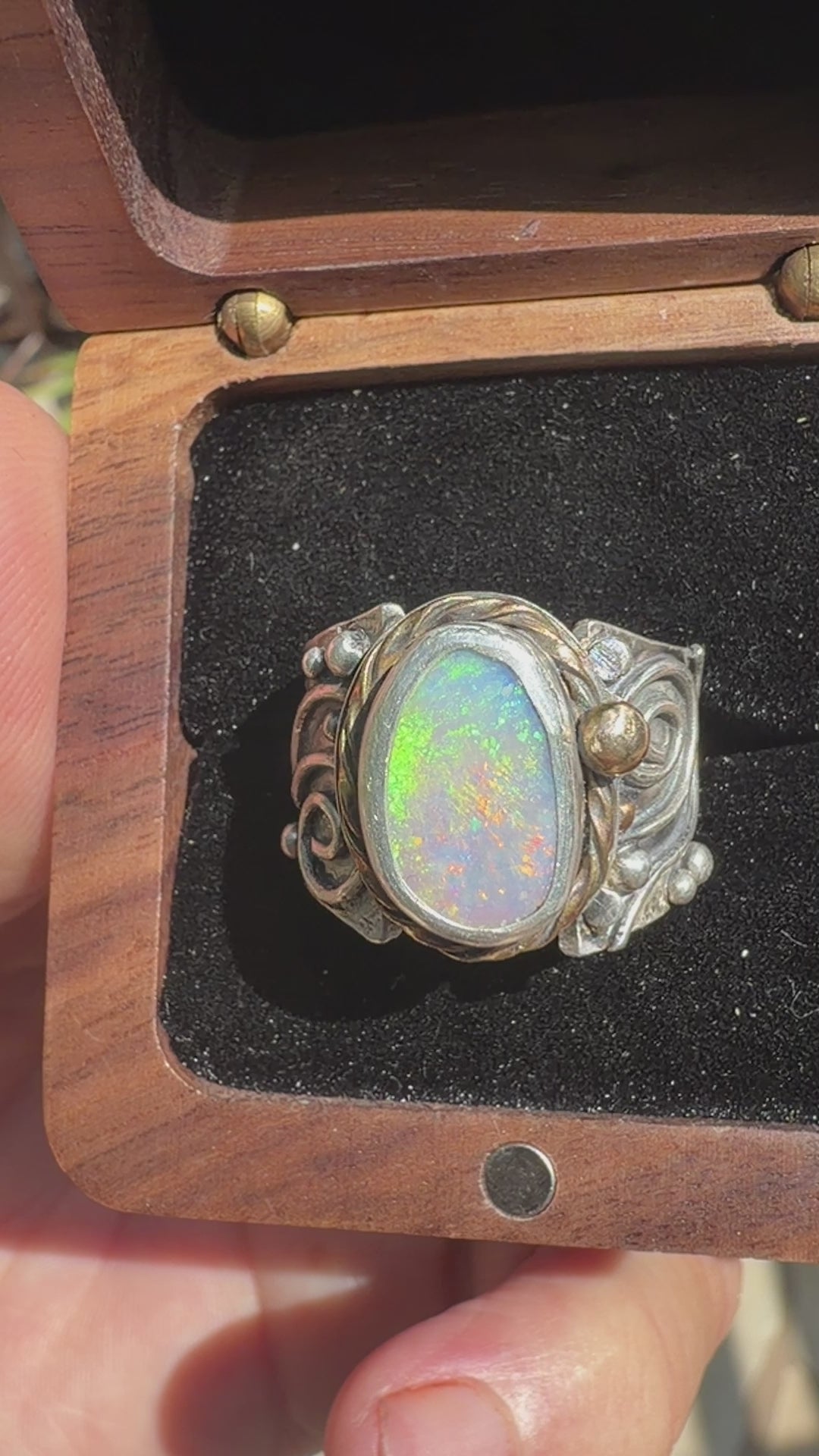 Sunlit Lagoon handcrafted Australian Coober Pedy opal ring in .925 sterling silver with a 14K gold rope bezel accent and gold accent ball.