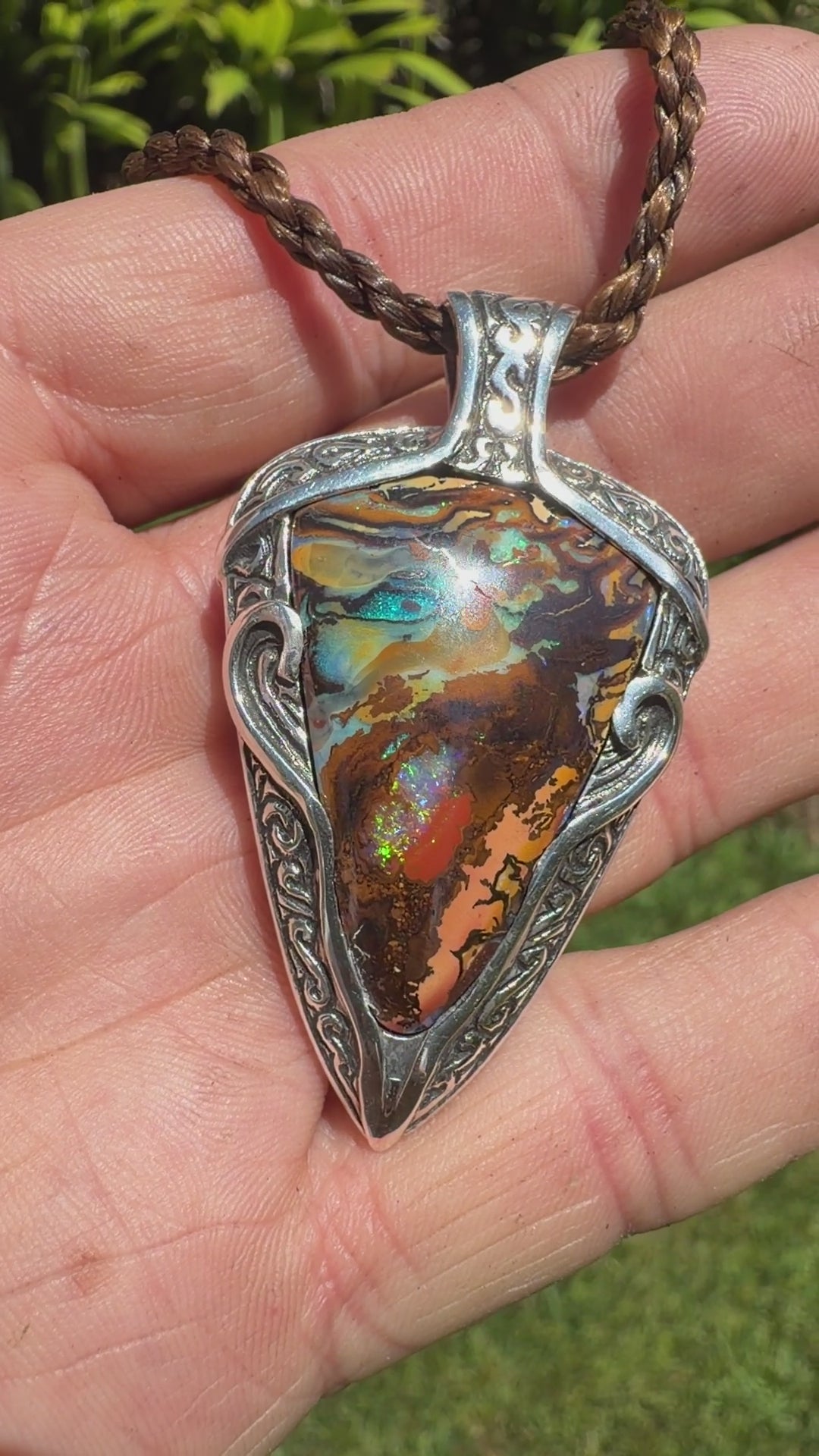 Ocean Current one-of-a-kind Australian Boulder Opal pendant handcrafted in solid .950 silver featuring vivid turquoise, blue, green, orange, gold, and natural Australian ironstone.