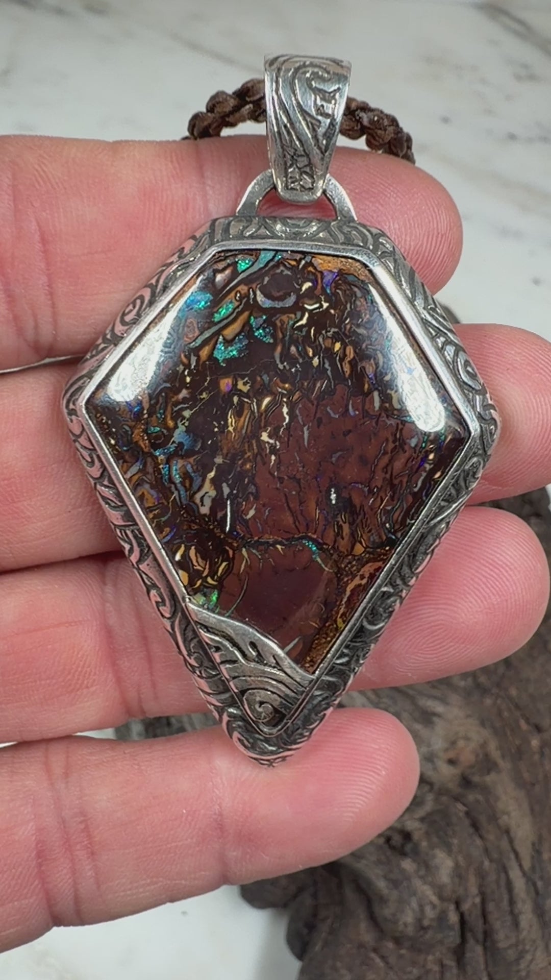 Ancient Veil is a one-of-a-kind Australian Boulder Opal pendant