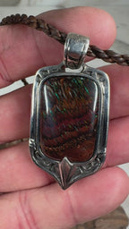 Ember Current Australian Boulder Opal shield pendant featuring vibrant green and blue fire in a handcrafted sterling silver setting by TIDAL OPALS.